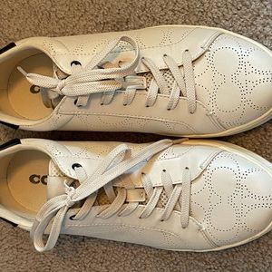 Size 10 woman’s Coach tennis shoes.